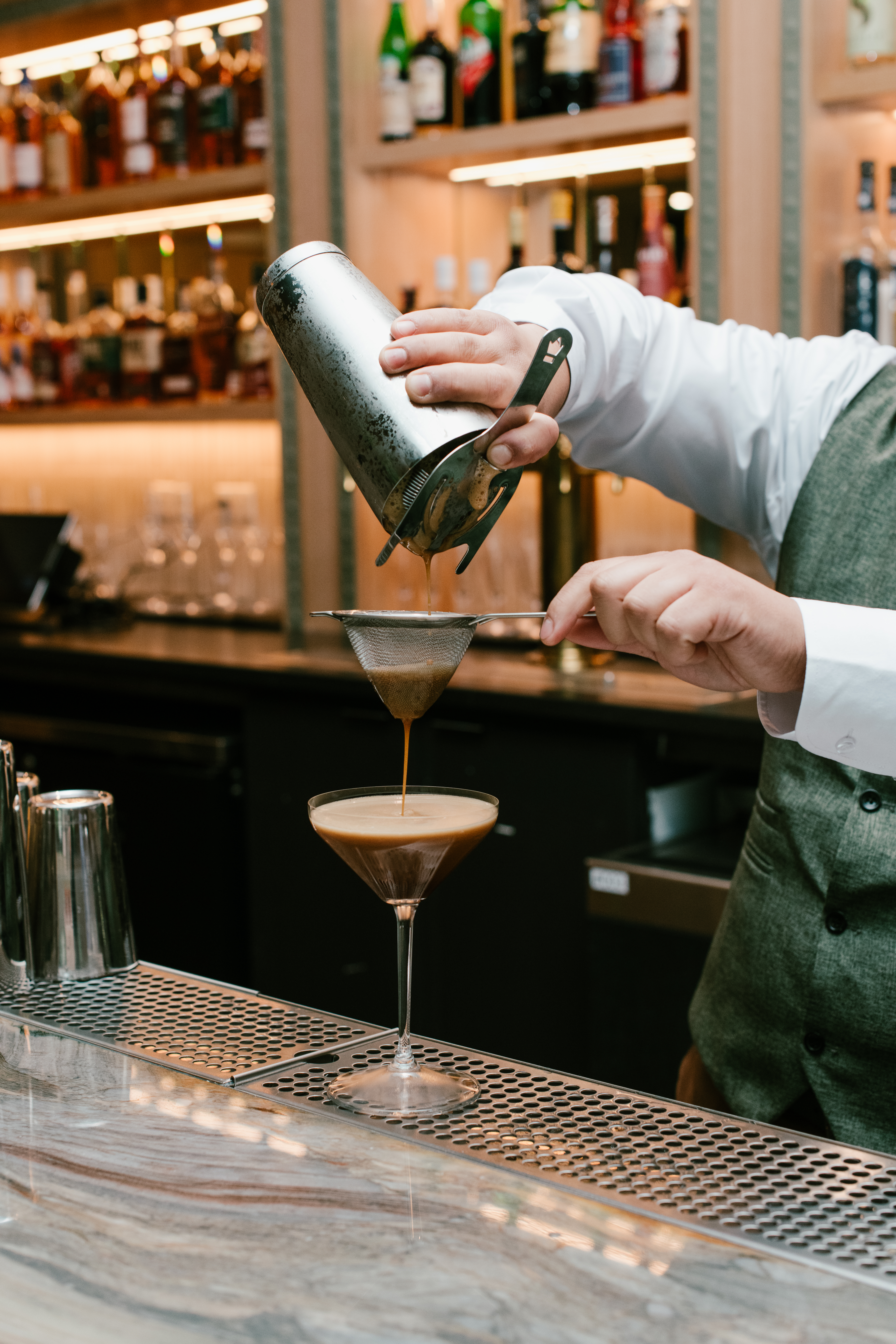 Espresso martini at Nic + Junior’s in River North, served in a coupe glass with a creamy top and signature garnish.
