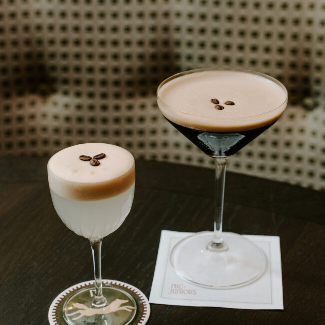 Clarified espresso martini and classic espresso martini on cocktail napkins at Nic + Junior’s in River North, Chicago
