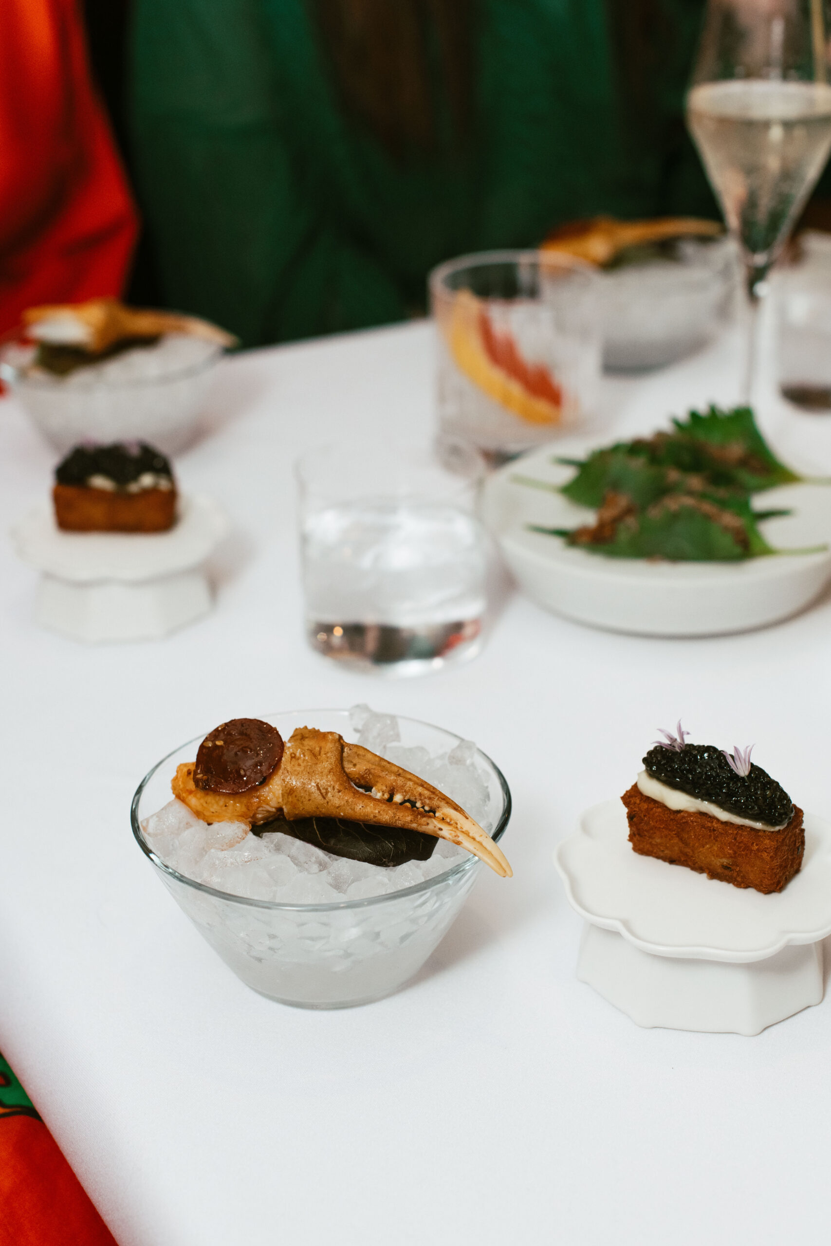 Champagne, caviar, and seafood courses during the tasting menu at Nic + Junior’s in River North, Chicago
