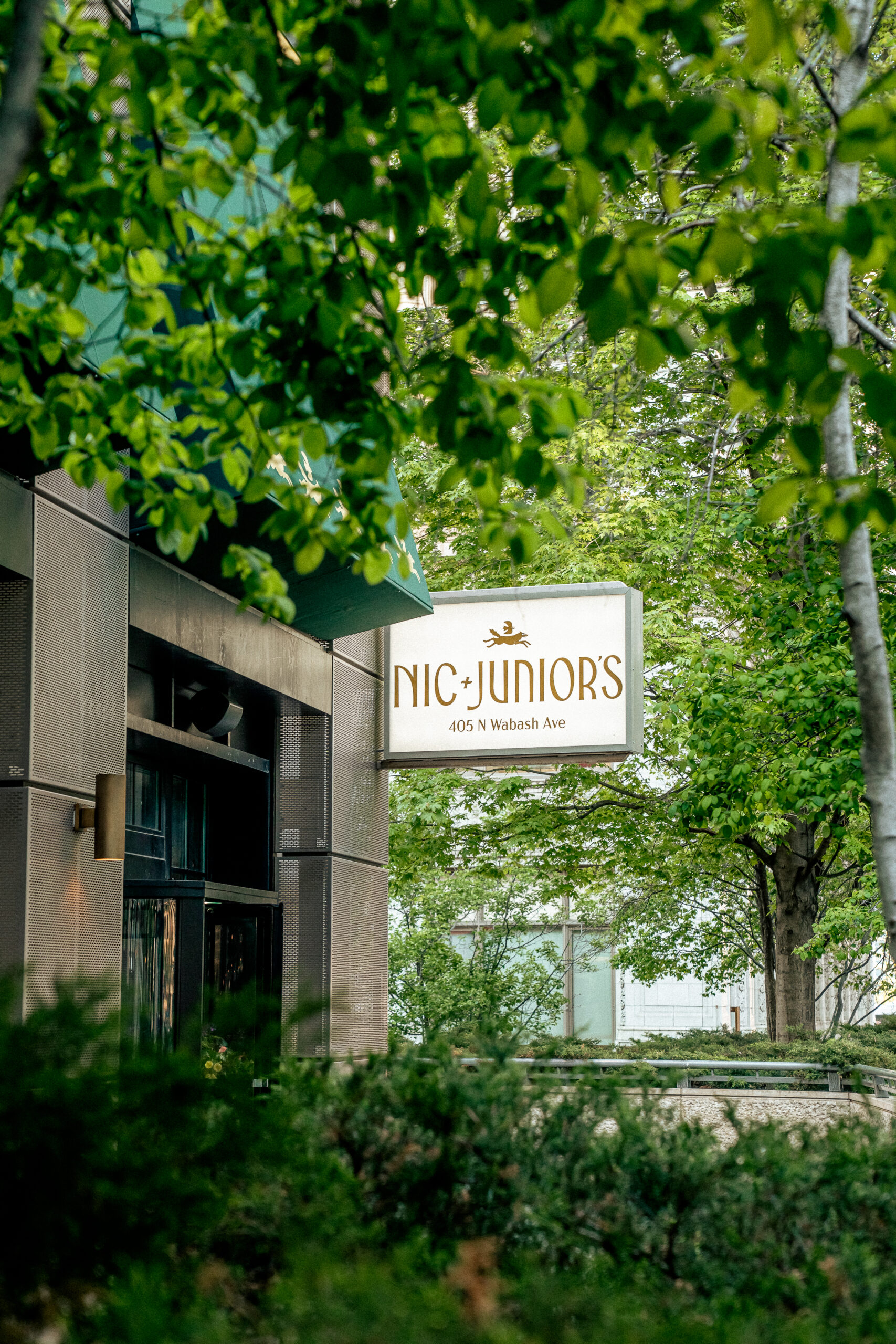 Exterior view of Nic + Junior’s in River North, Chicago, showing the restaurant’s front entrance, signage, and design-forward architecture.