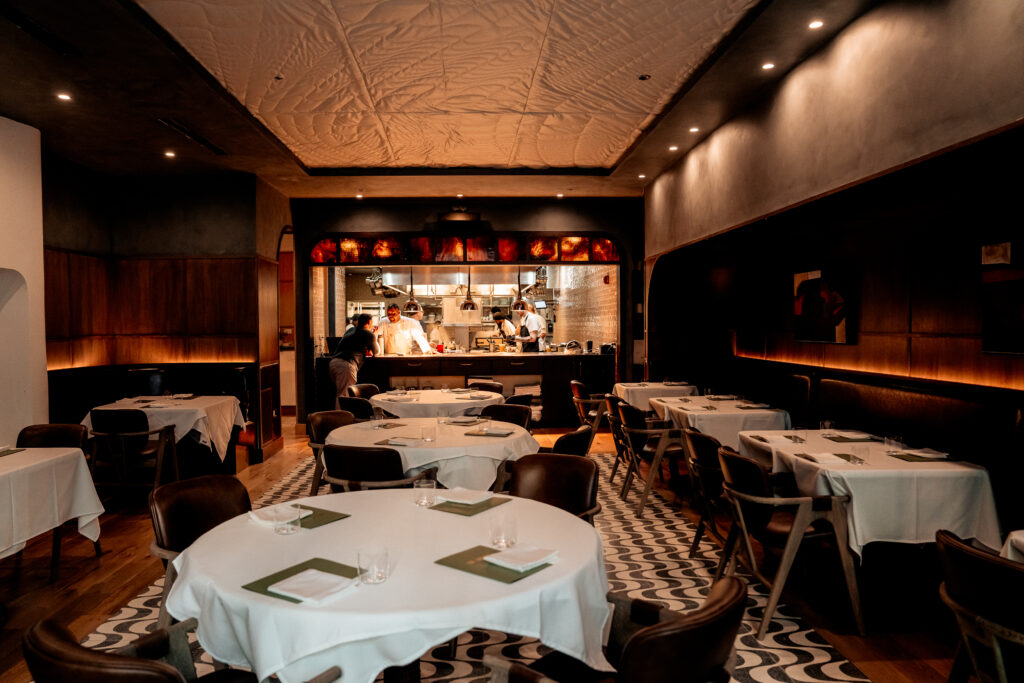 Chef team working in the open kitchen of Nic + Junior’s tasting room in River North, Chicago